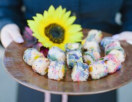 Colorful sushi rolls with sunflower accent