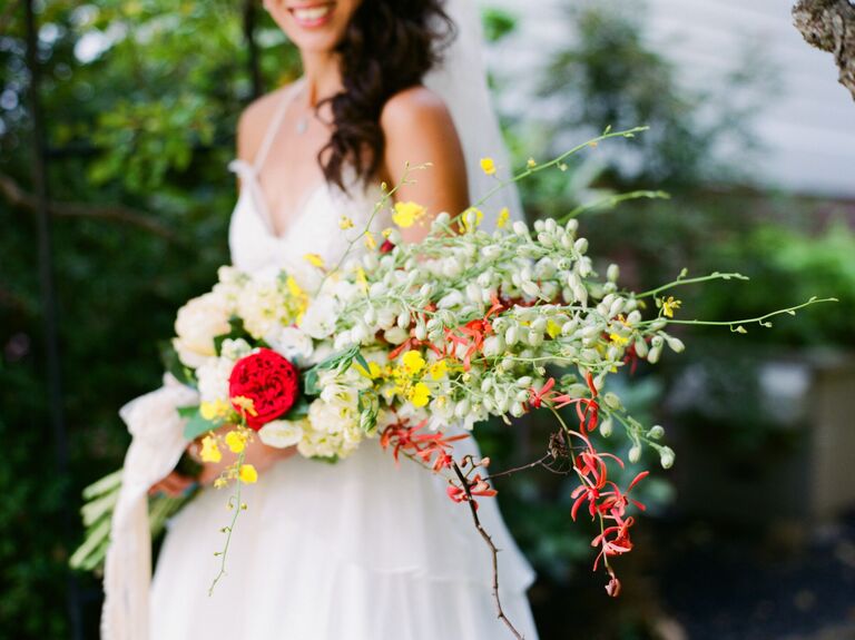 Bride holding presentation style bouquet.