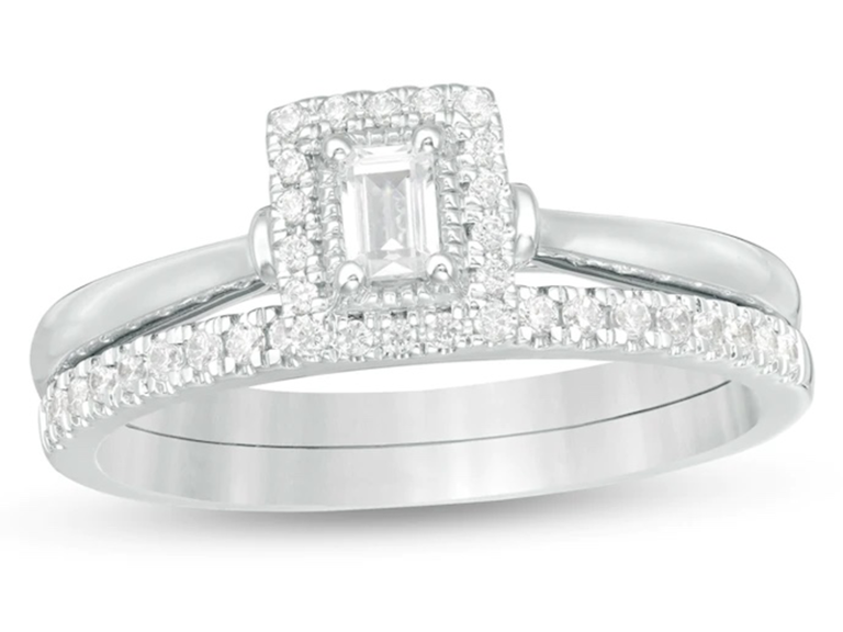 Emerald cut center diamond with halo and plain silver band and pave diamond band