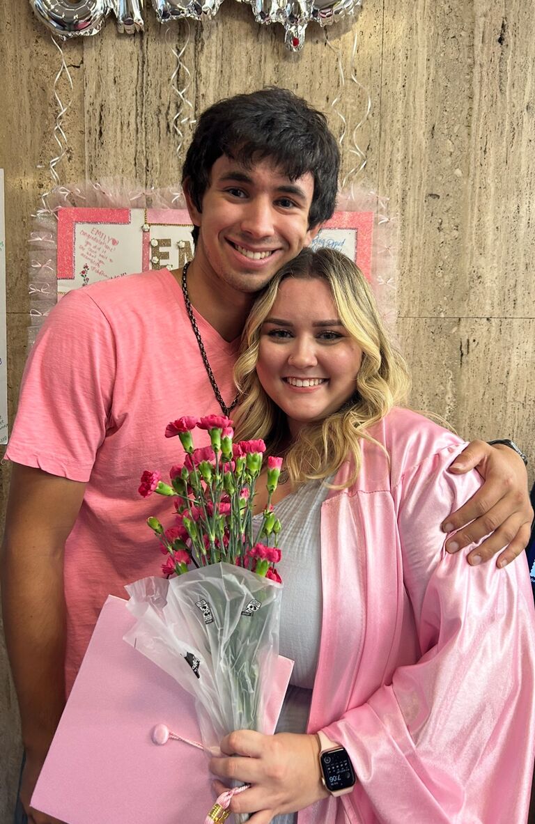 Emily graduates from Paul Mitchell Cosmology School. 