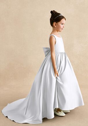 Mimia is our classic matte satin flower girl dress. She features a scoop neckline, a V-back with a bow tie, and a pleated A-line skirt flowing into a chapel train. She is the perfect dress for your flower girl.