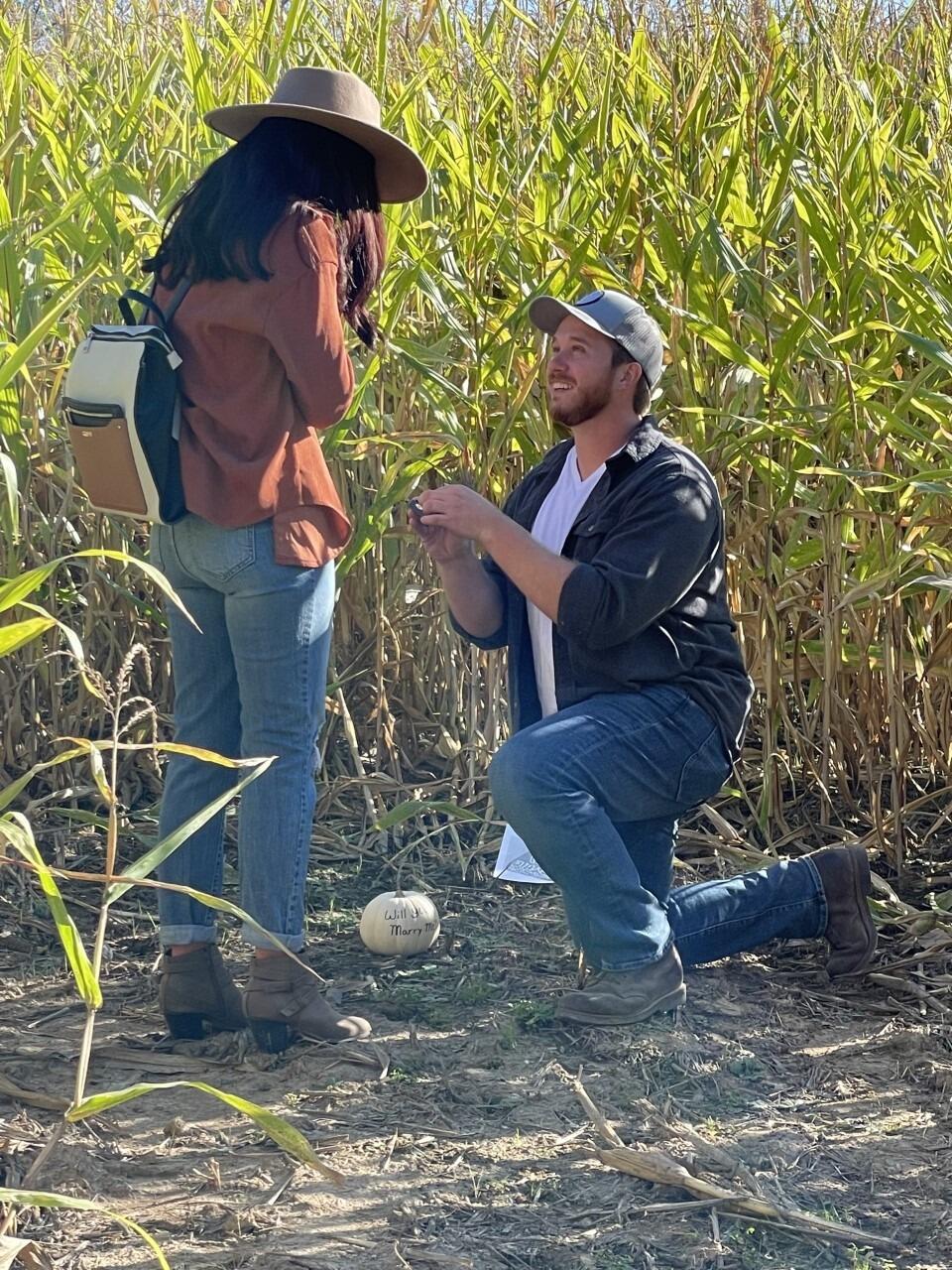 Cavin (finally) PROPOSES! 
Fun Fact- He tried to propose at a pumpkin patch, but the pumpkin crop had all died that year... he proposed in the corn maze instead! 