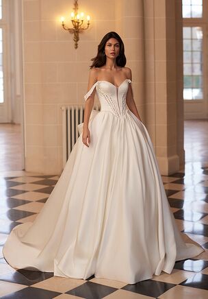 The Moonlight Couture H1655 wedding dress is a regal satin A-line gown featuring a strapless, intricately beaded bodice with a deep sweetheart neckline, illusion details, and a sculpting basque waist. Finished with bold box pleats, a dramatic chapel train, and optional swag sleeves and detachable bow, this ivory or white gown blends timeless elegance with customizable, fairytale-worthy drama.