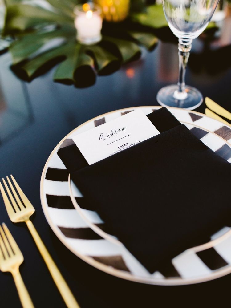 black, white and gold place setting