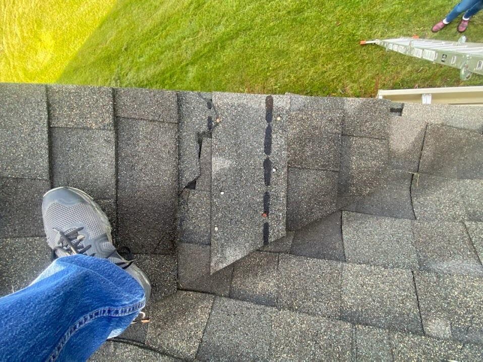 After the wind tore a piece of trim off of Laura's roof, she and Josiah tried to figure out a way to fix it.  Unfortunately, neither of them do well with heights.  So Laura called someone she knew who has no problem with heights at all - Mike.  After the trim was up, they talked in the kitchen for about 3 hours.