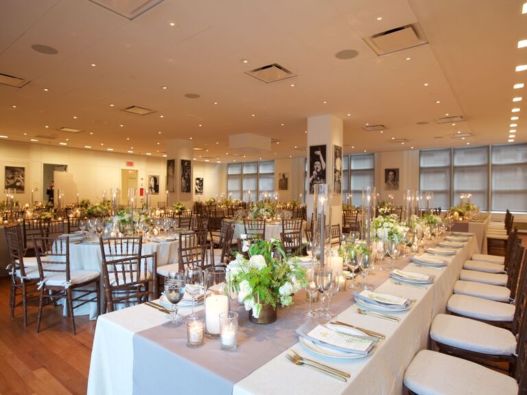 Modern reception space with paintings, tables and chivari chairs