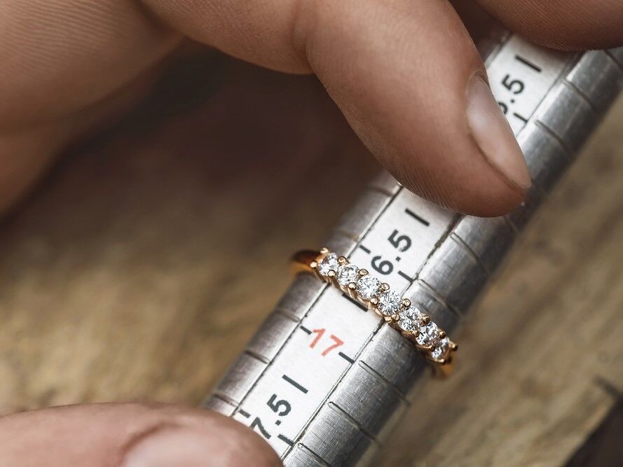 Engagement ring in a metal sizer