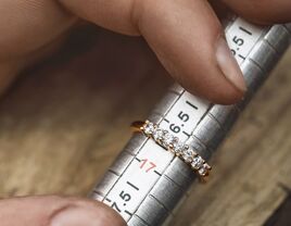 Engagement ring in a metal sizer