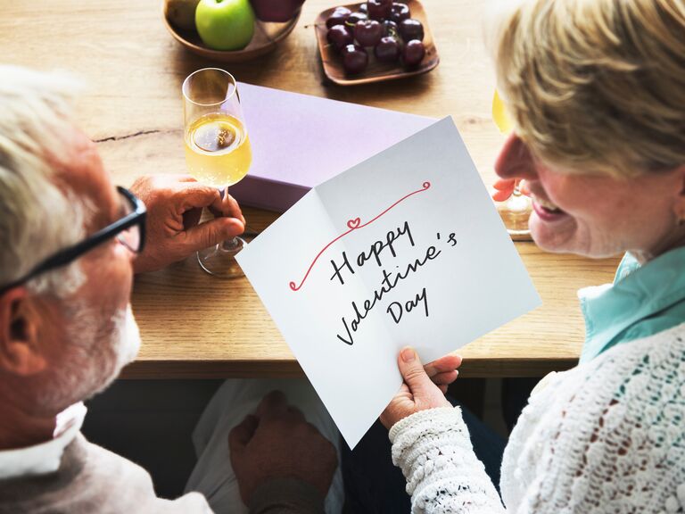 couple looking at cute happy valentine's day card message