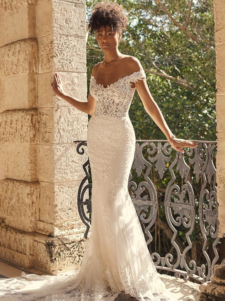 maggie sottero white strapless sheath wedding dress with lace chest and form fitting pleated flowy lace skirt