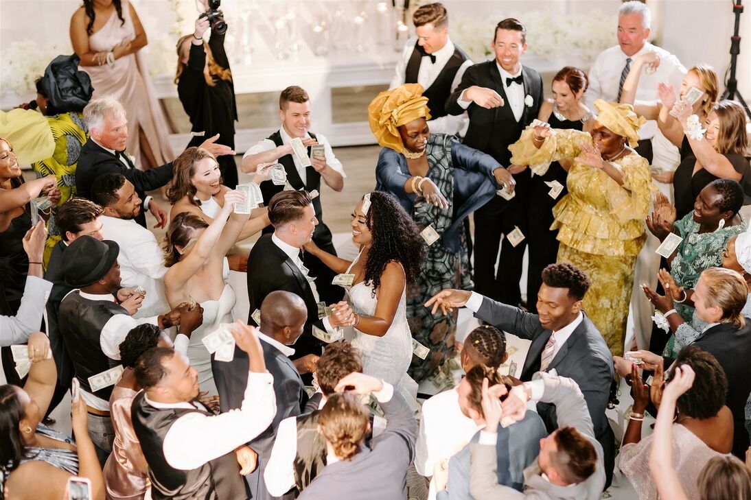 Guests dance around the happy couple.