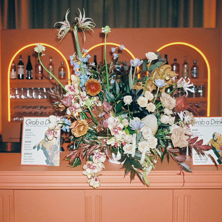 Orange bar with centerpieces, taylor swift themed wedding