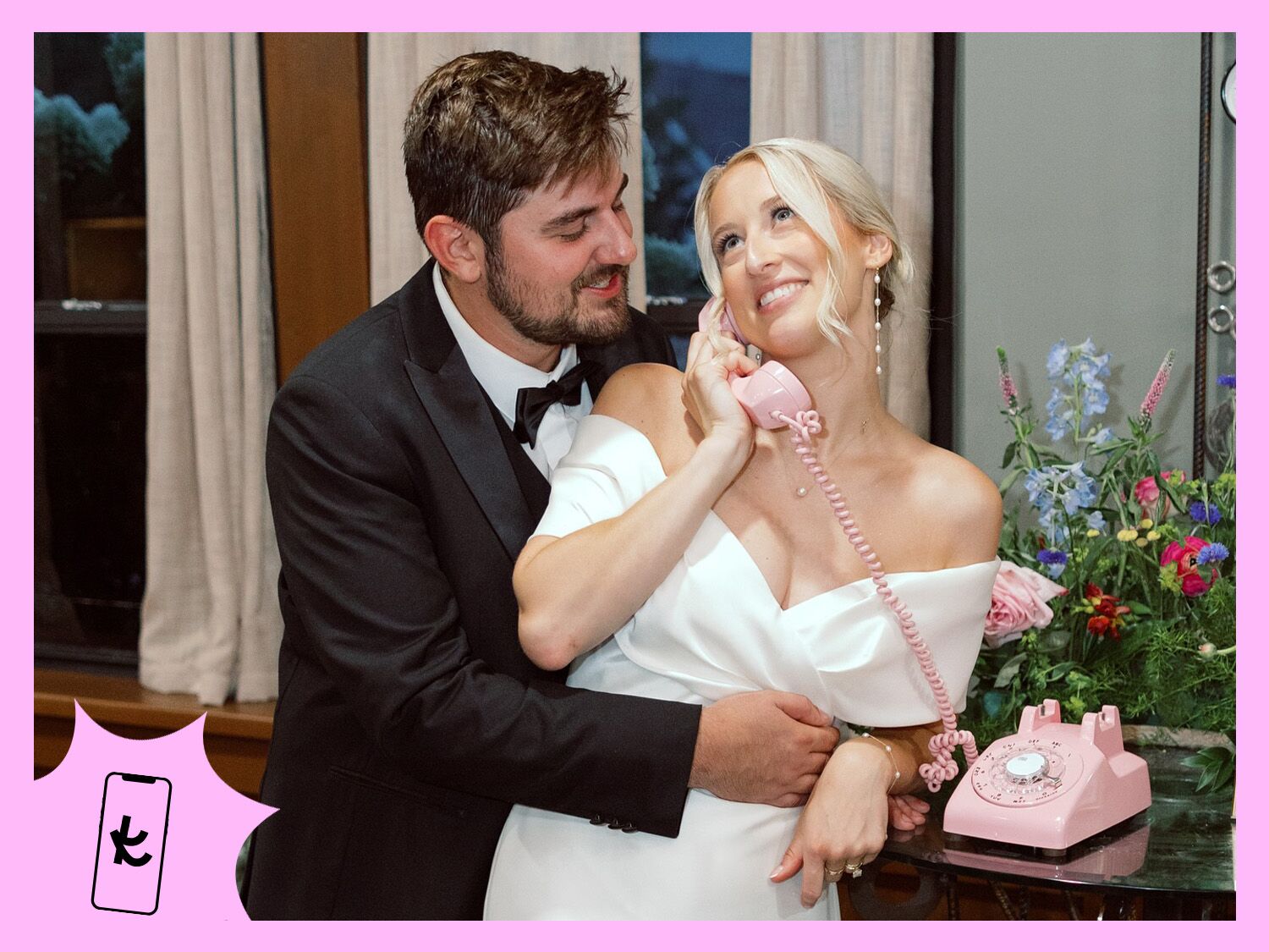 Couple on their big day using a pink retro phone