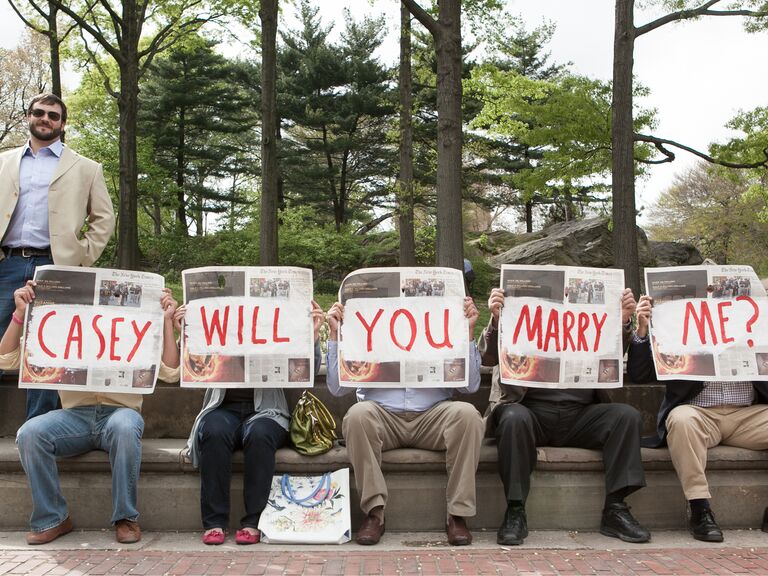 Newspaper marriage proposal with surprise family guests