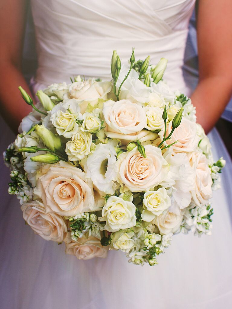 White wedding bouquet with roses, spray roses and lisianthis