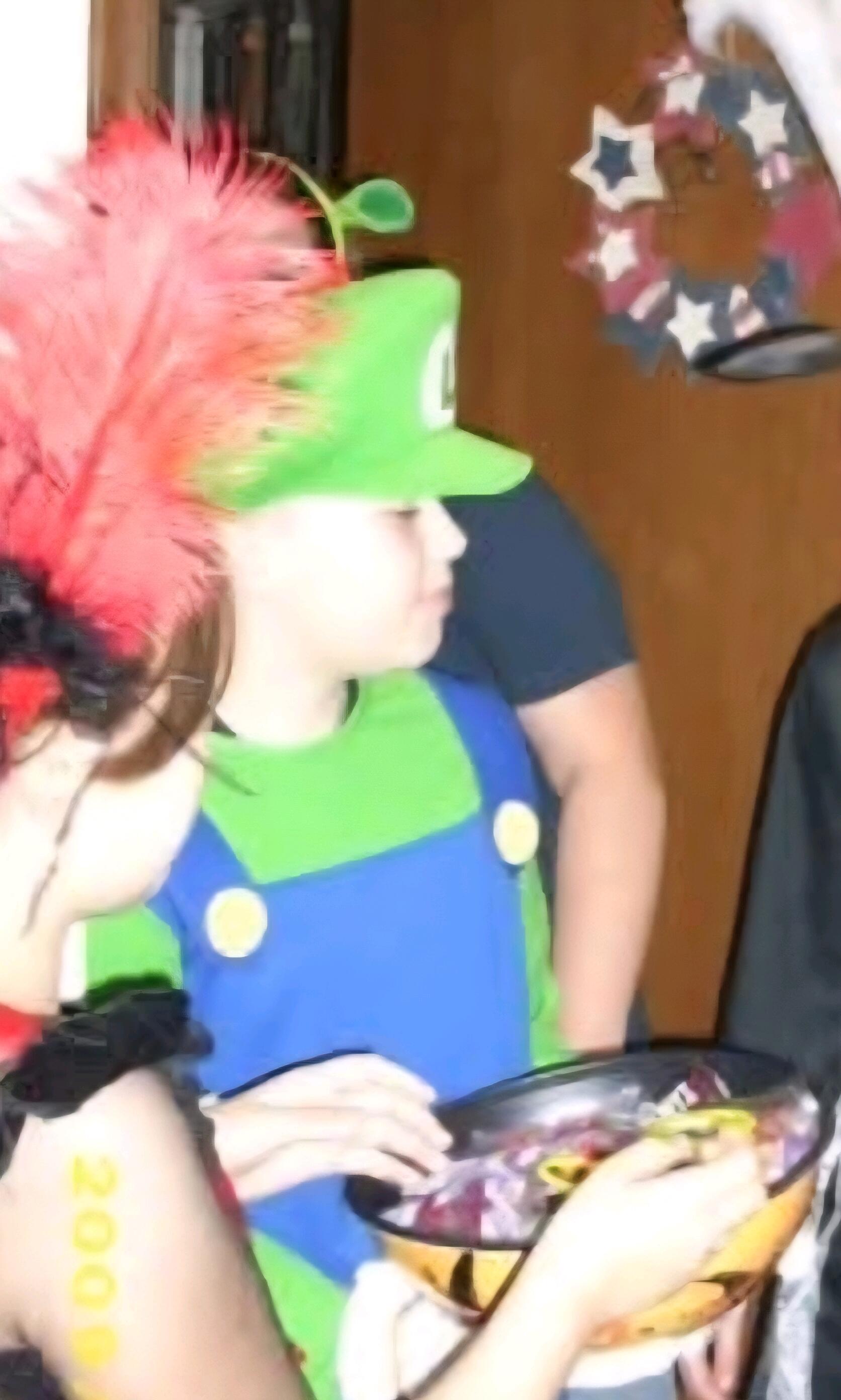 Mary (far left) and Tyler (middle) on Halloween 