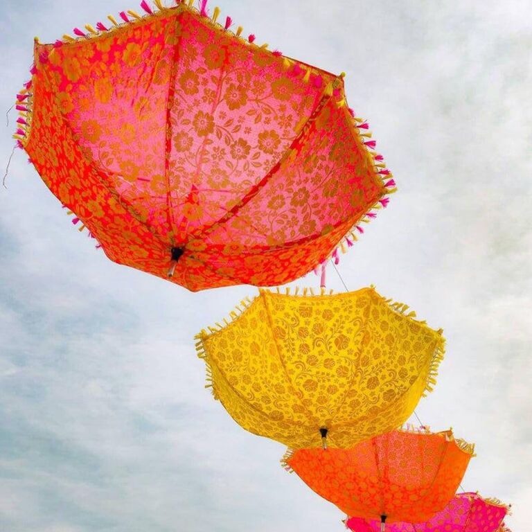 Colorful parasols hang upside down. 