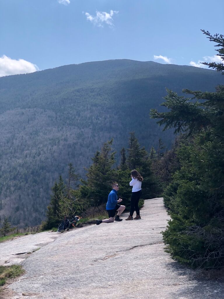 Nick, Meredith, and a few close friends drove up to New Hampshire for a day trip. They hiked to the summit of Mount Willard where Nick got down on one knee and proposed to Meredith. 