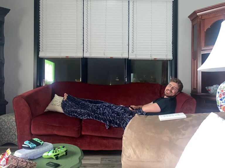 Nate and Haley move to a cozy new apartment in downtown Dekalb. The big red sofa is new, and deeply loved, making for a perfect home for planning the big day!