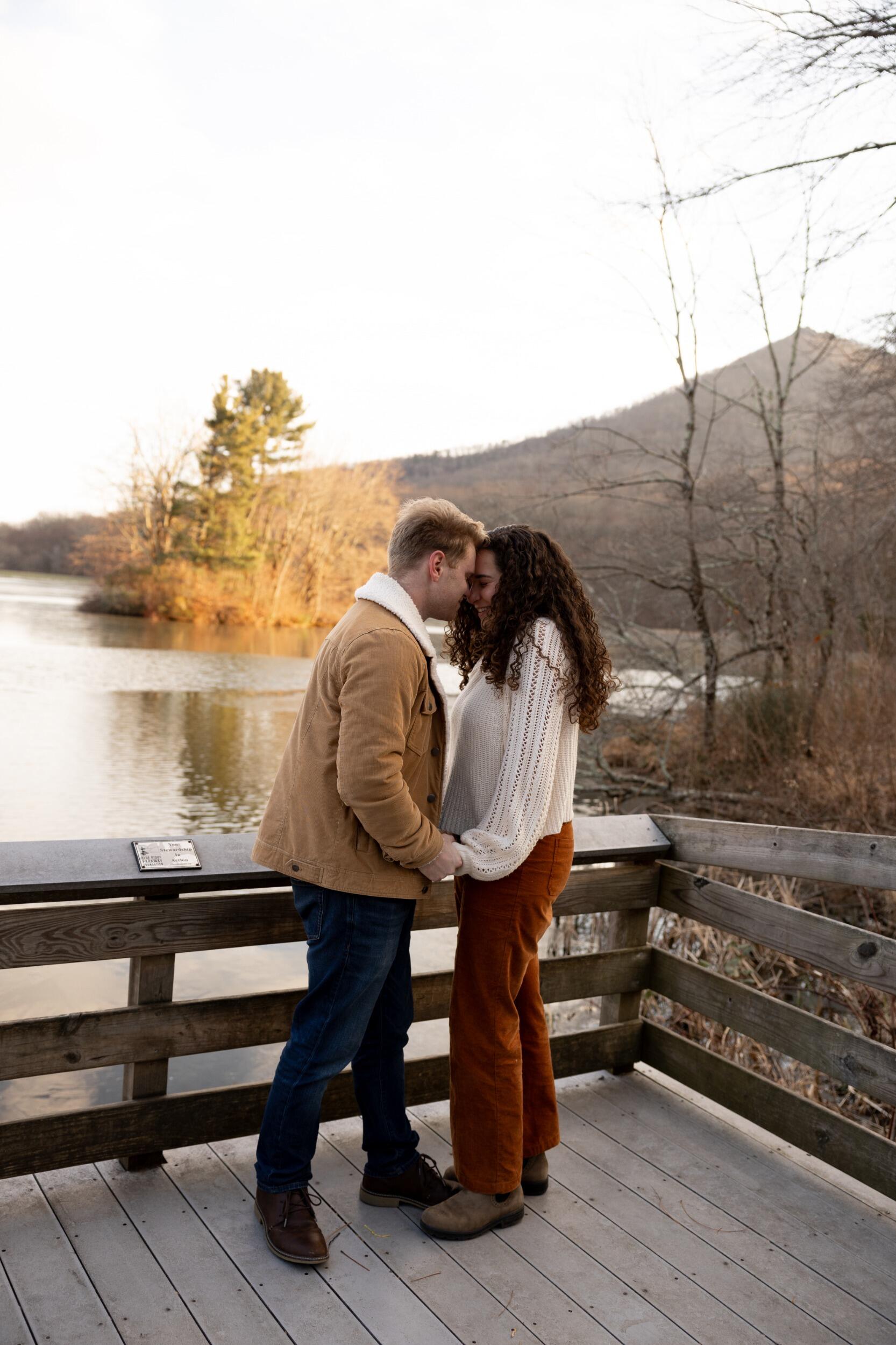 Both Em and Michael love photos, so Michael suggested that they try to take photos on the parkway together. Unfortunately, the parkway was closed and they randomly ended up at the Peaks of Otter Lake and took photos in front of Sharp Top, one of their favorite local hikes.