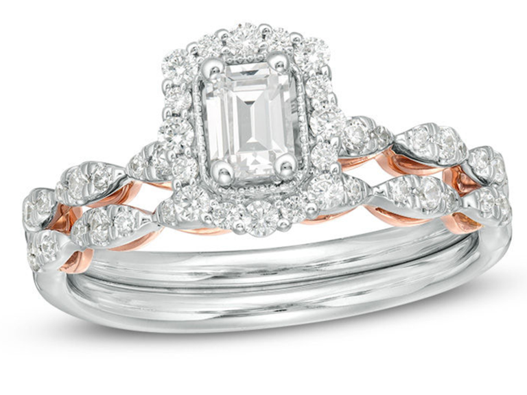 Emerald center diamond with thin border and diamond halo on scalloped diamond double band with rose gold interior 
