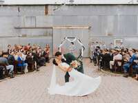 Newlyweds kissing at the aisle during their ceremony