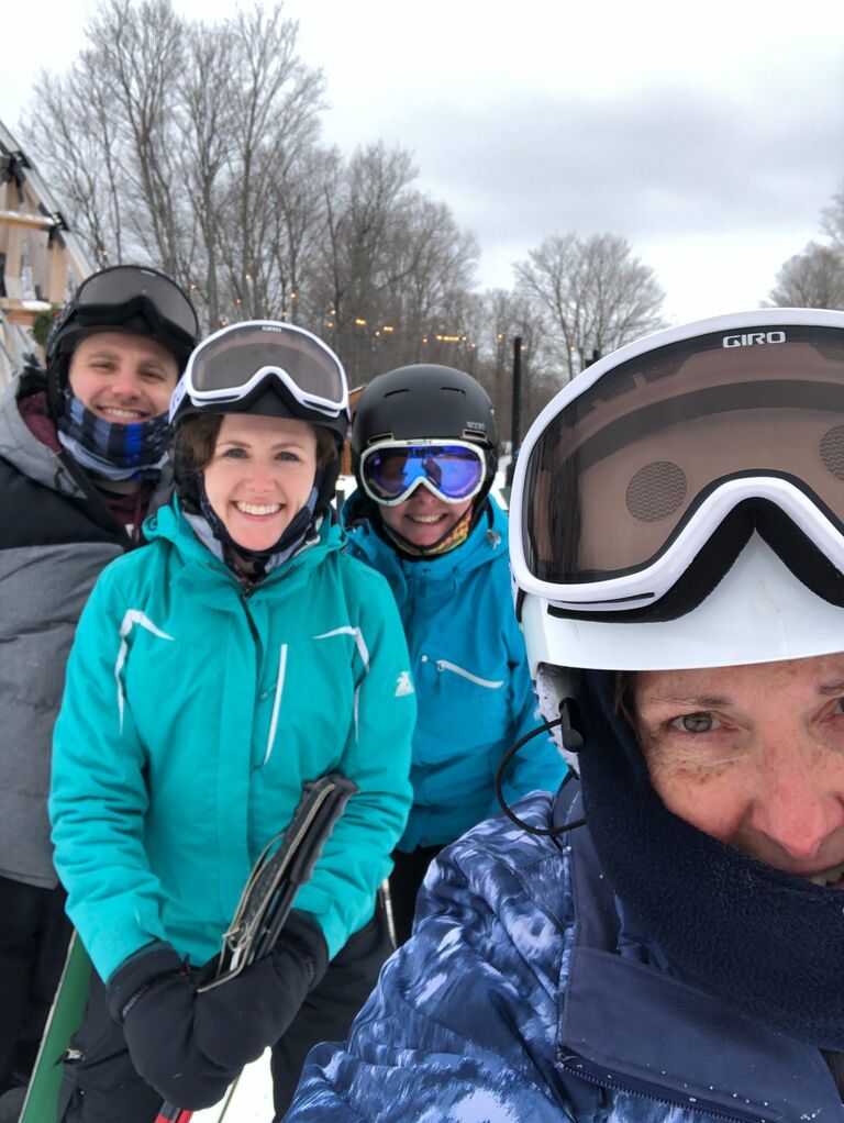 Bryan is a good sport learning to navigate the slopes (and ski lift) in Boyne