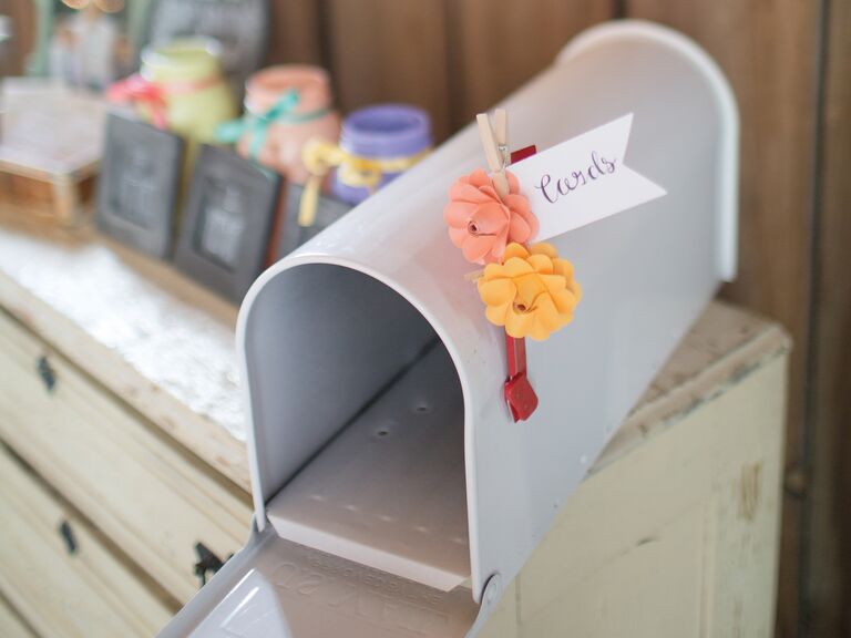 Gray Wedding Card Mailbox With Pink And Orange Flower Flag On Reception Table