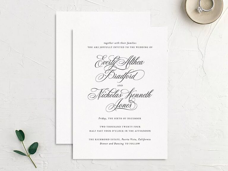 Detailed cursive type with focus on couple's names on white background