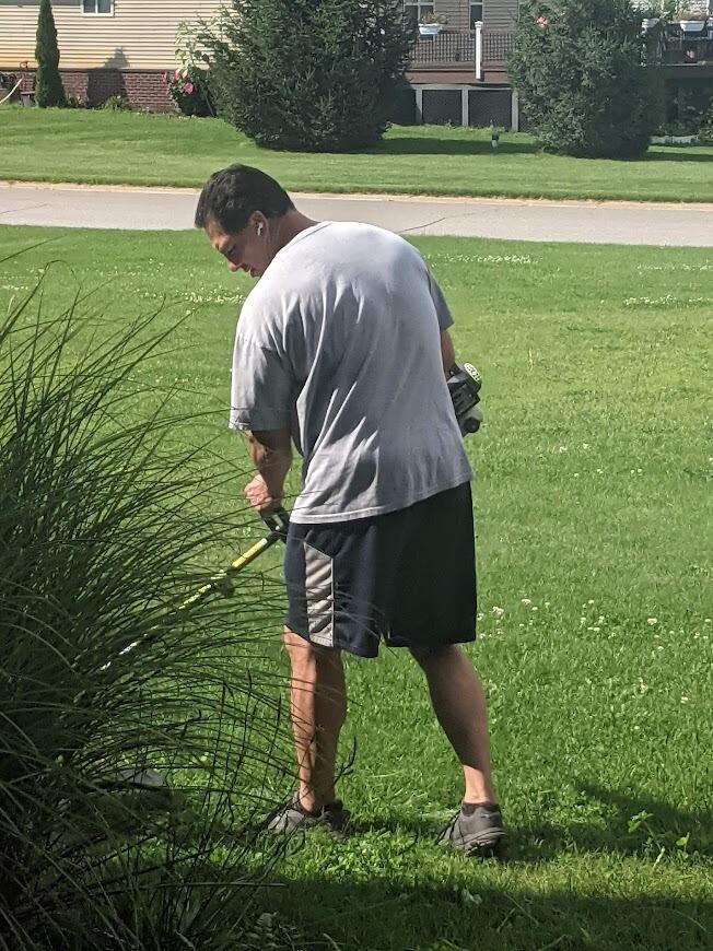 Laura wasn't the only one doing more helping... Mike helped clean up Laura's Aunt's yard when Laura's cousin was getting the house ready to sell.