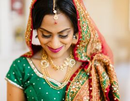 Indian bride wears beautiful gold jewelry. 