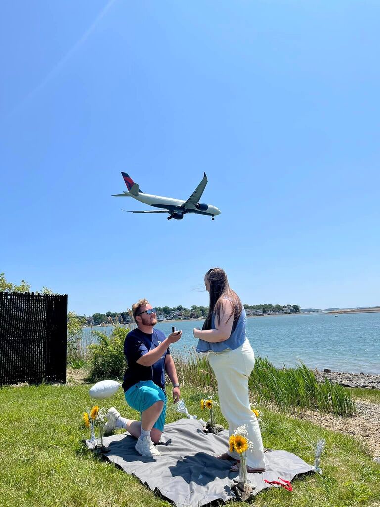 John proposed to Delaney in East Boston where the planes were landing. (Yes, the plane is a paid actor)
