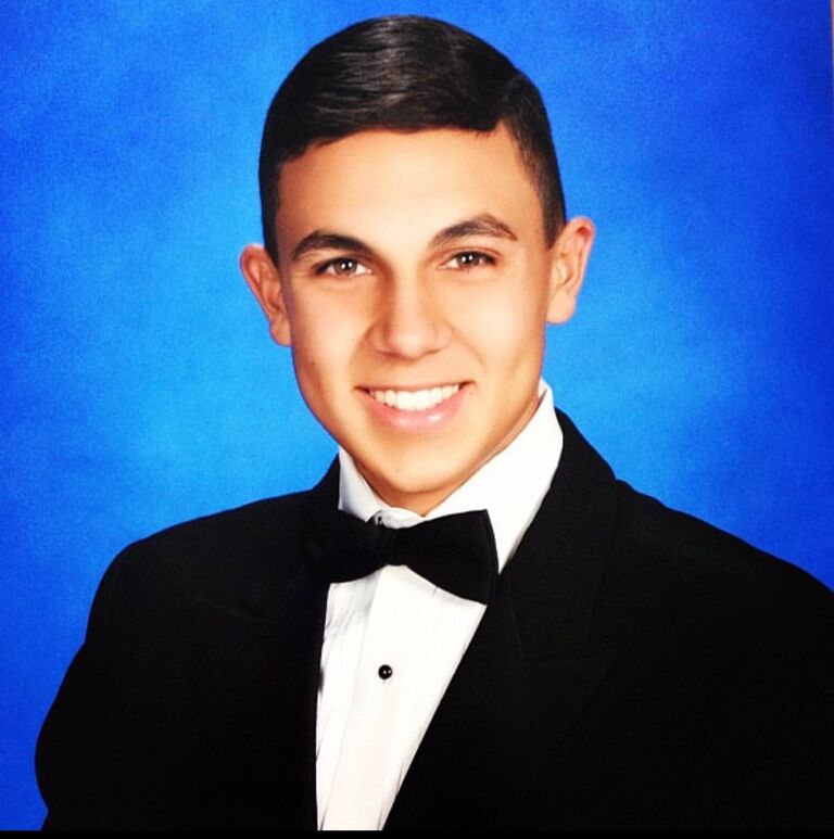 Fernando graduates from Robert Morgan Educational Center class of 2014.