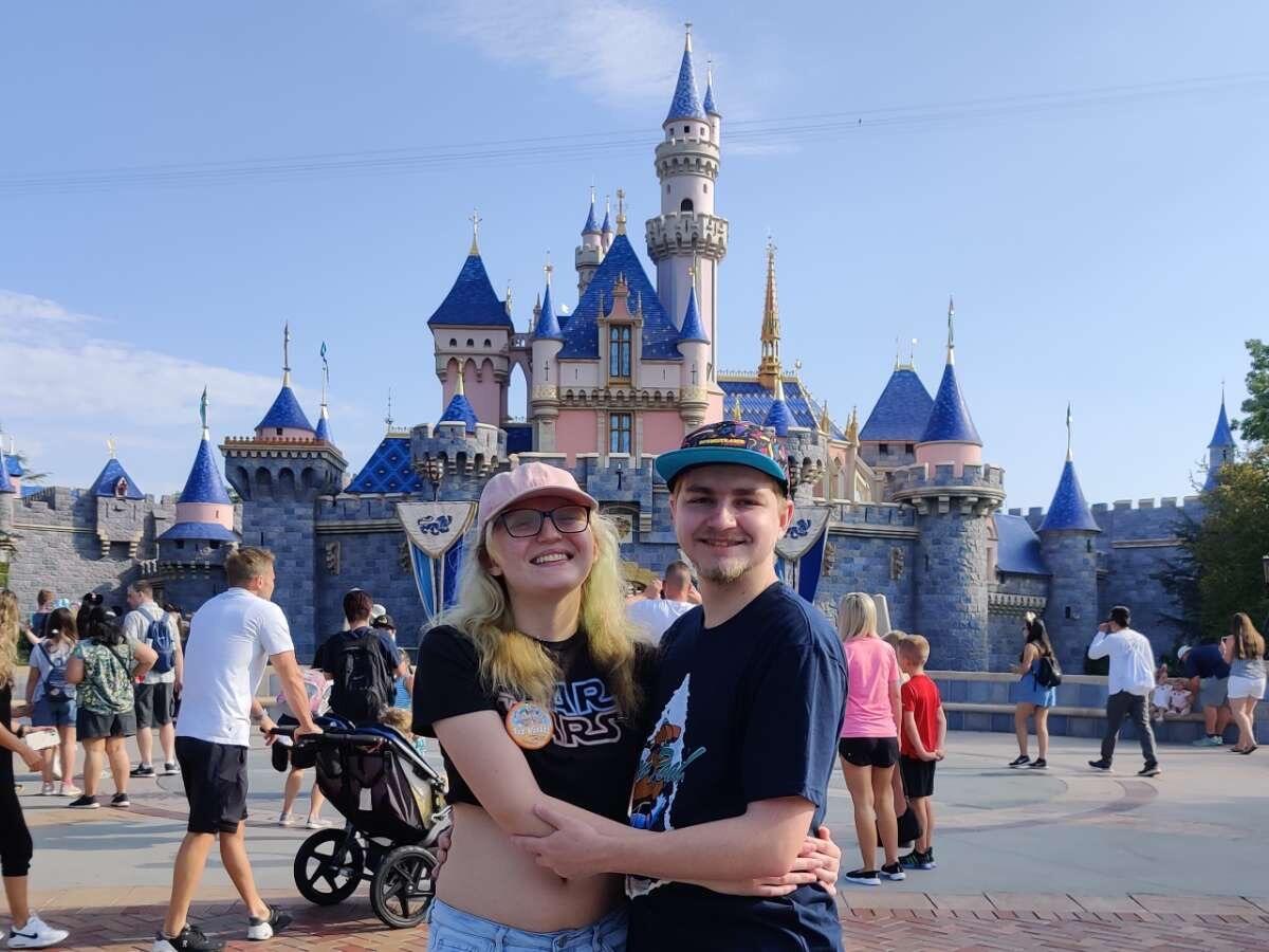 Our first Disneyland trip together in front of Sleeping Beauty castle