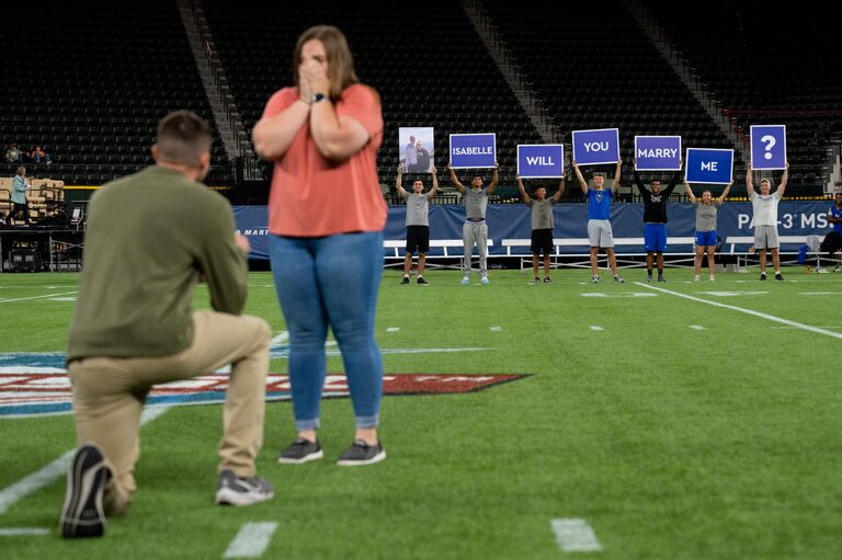 Little did Isabelle know, Tyler had planned a surprise proposal during their "tour" of the Texas Rangers stadium
