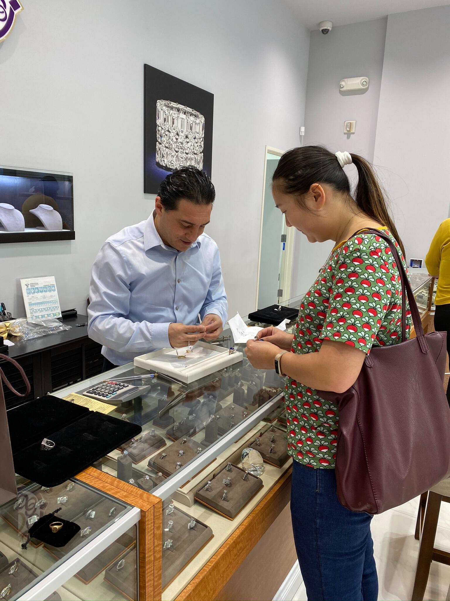 Lora and her friend snuck away to Pasadena to custom design Allison's engagement ring. By pure serendipity and no prior planning, the ring Allison gave Lora happed to be made from the same type of stone, a perfect pairing. 