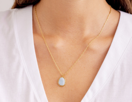 Light blue raw-cut gemstone on gold chain