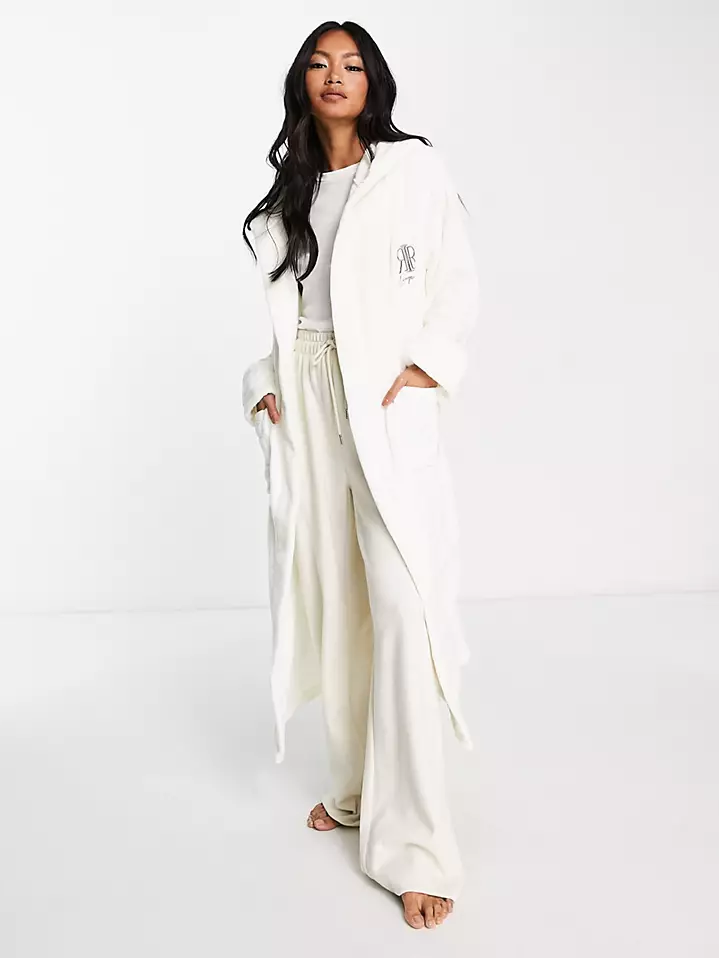 A model shows off this glamorous white Fleece Bridal Robe.