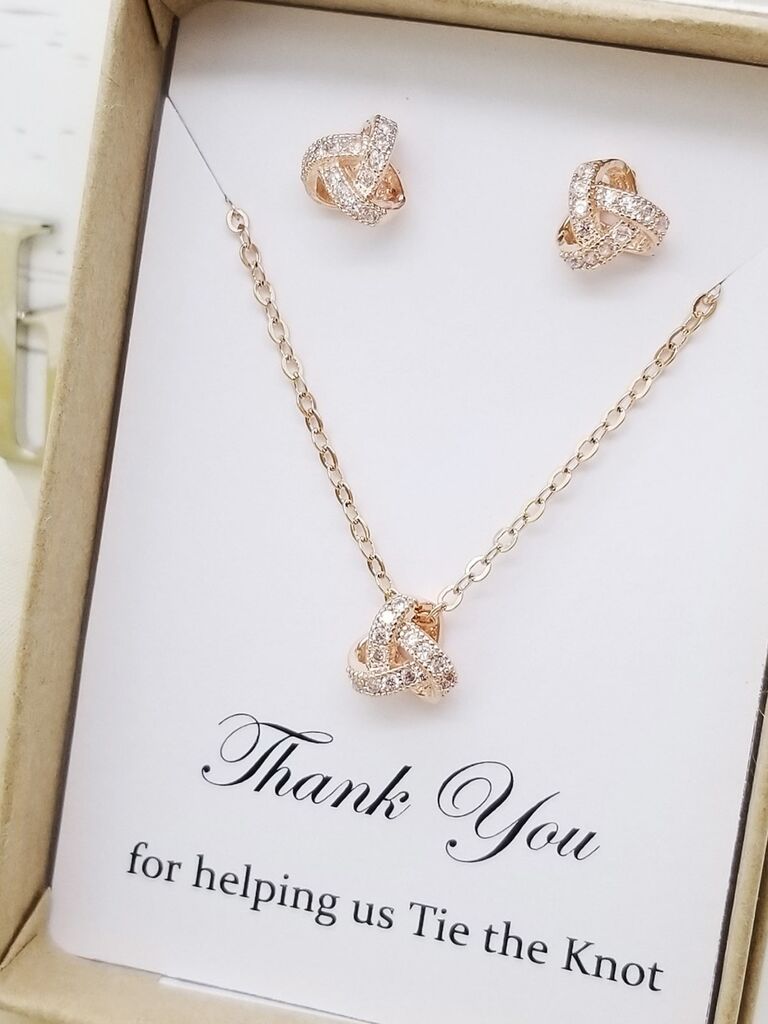 A rose gold knot pendant and stud earrings with clear crystals from Etsy