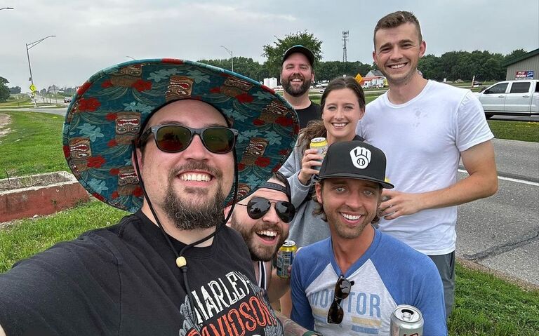 Meeting the band! We had been camping in Okoboji and happened to see this crew drinking on the side of a county high way and getting cars to cheer and honk for them. So naturally we stopped and offerred them some of our camping beers and sat and joined for a few hours. We came to find out they were performing at a local venue and were they a blast to see on stage! 