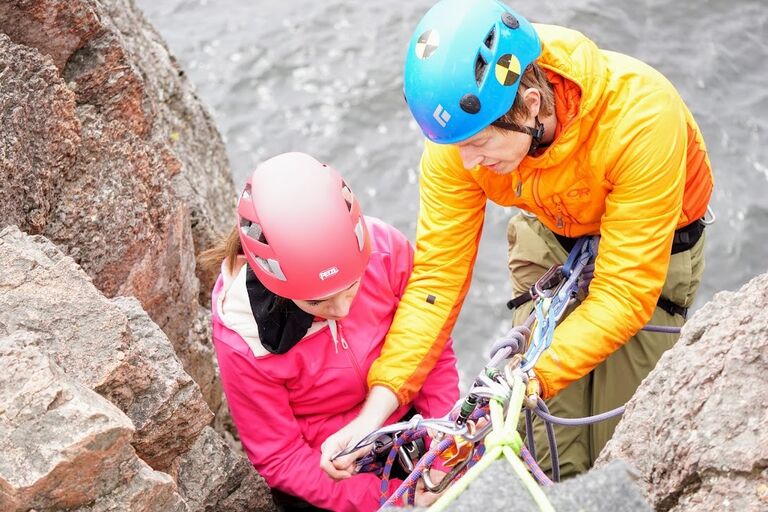 Covid hit and we weren't allowed to do indoor activities, so we took the hanging out to the outdoors! This was Zach teaching Jenna how to rappel and continue climbing at Shovel Point.