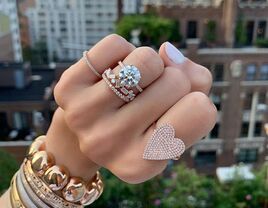 Engagement ring and stacking rings on hand