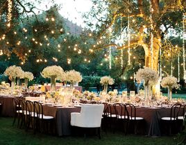 Hanging lights over outdoor wedding reception