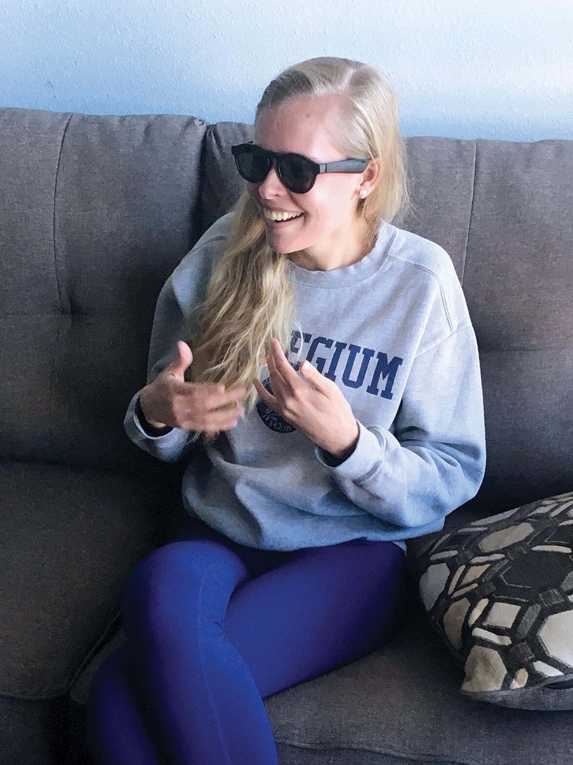 GOOFING OFF. Emily tries on Graeme’s sunglasses during an end-of-semester “heathen day.” As Derek watches Emily relax and goof off in front of him and their friends, he knows they have a good shot of “doing well together with our friends, and that they all do, too, with us.”