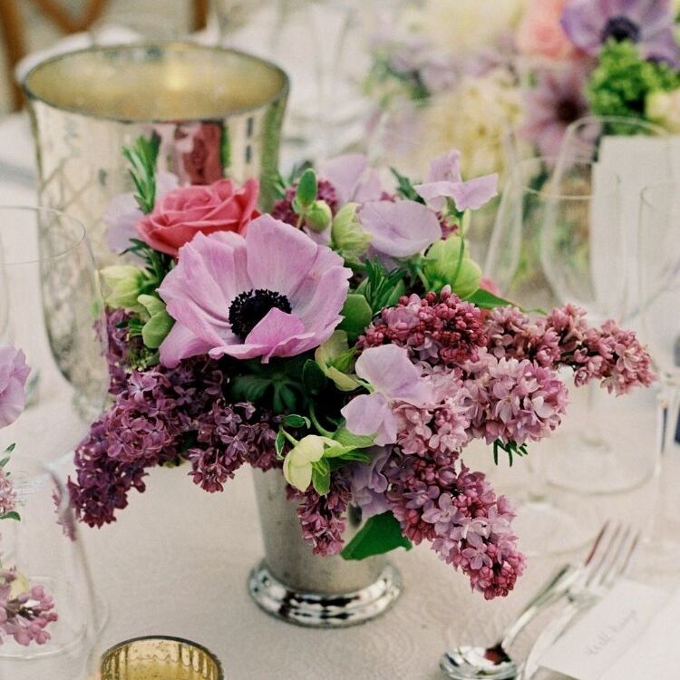 purple lilac and anemone floral design in silver mint julep cup
