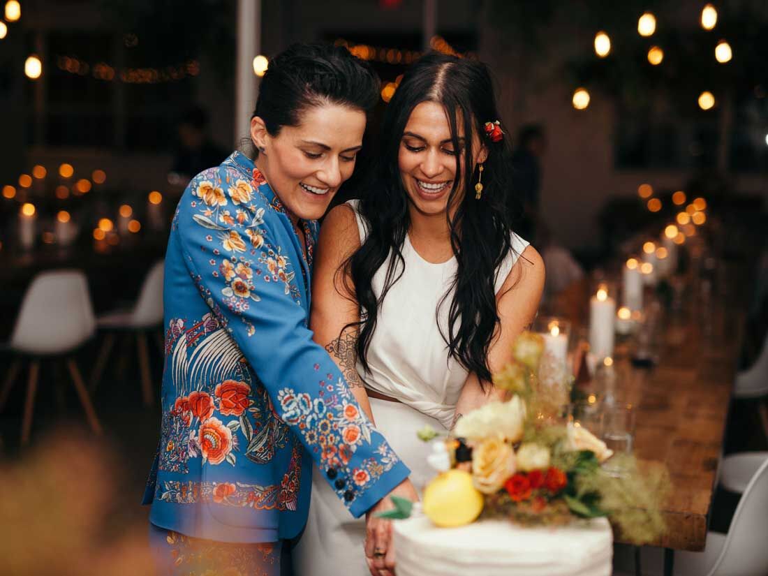 Couple cutting the cake at wedding reception