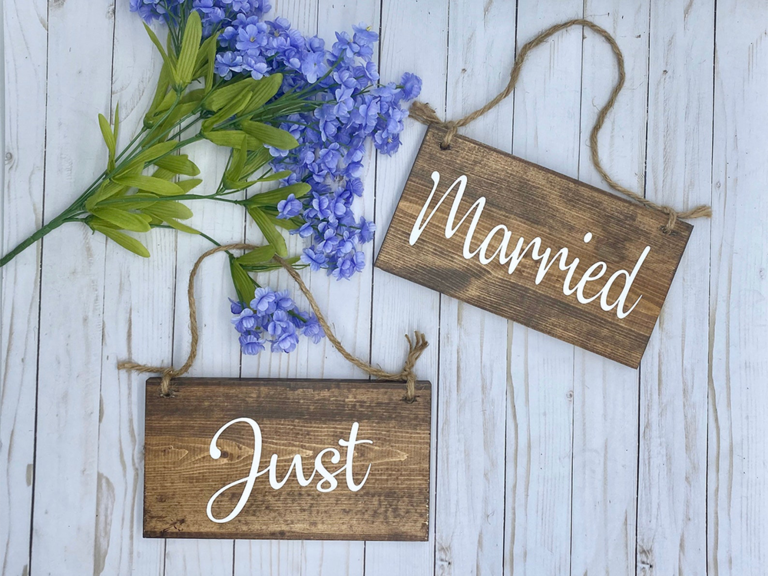 Rectangle wooden signs with 'Just Married' in white calligraphy