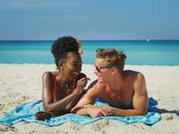 A happy young couple on their beach honeymoon 