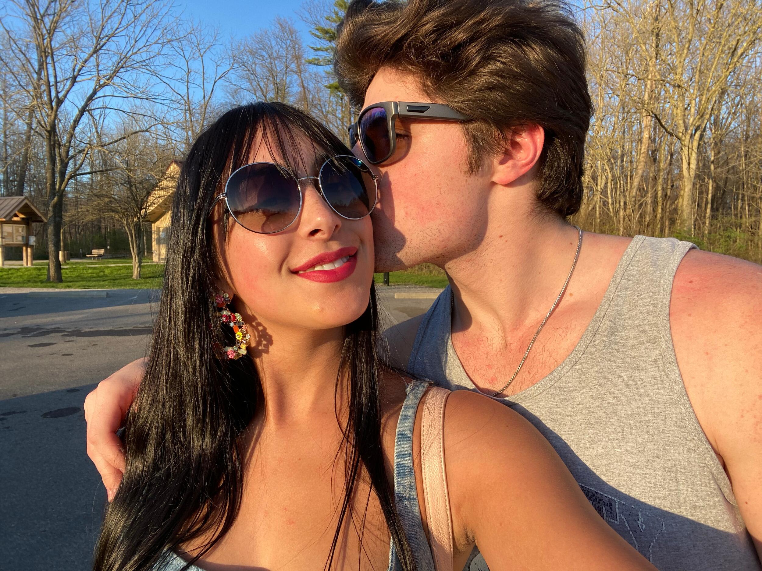 Lila and Tyler on their fourth anniversary picnicking in a park... socially distanced of course!
