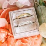 Wedding rings surrounded by flowers